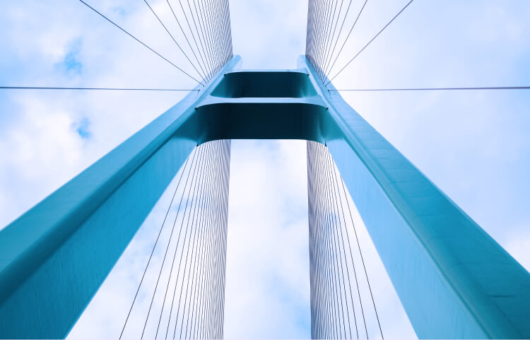 Abstracted worms eye view of the golden gate bridge, framed by a cloudy sky